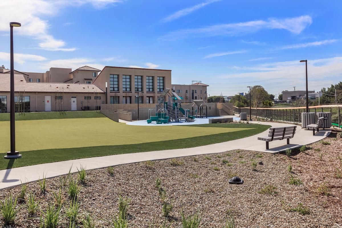 Paradise Creek community playground with wooden benches