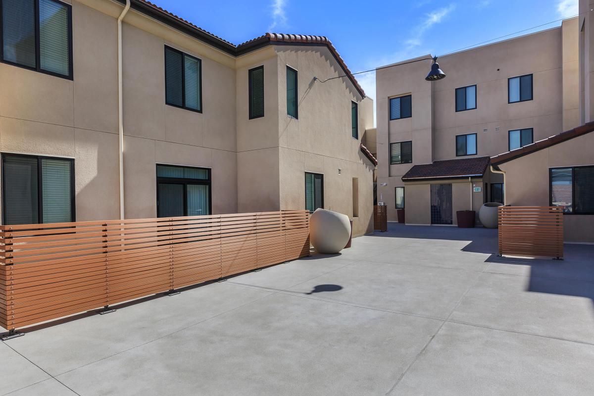 The community buildings with wooden fences