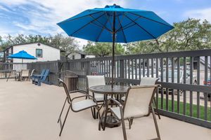 a table topped with a blue umbrella