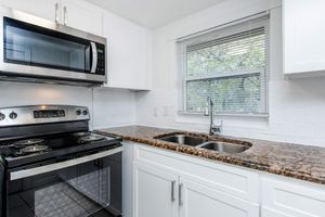 a kitchen with a stove top oven