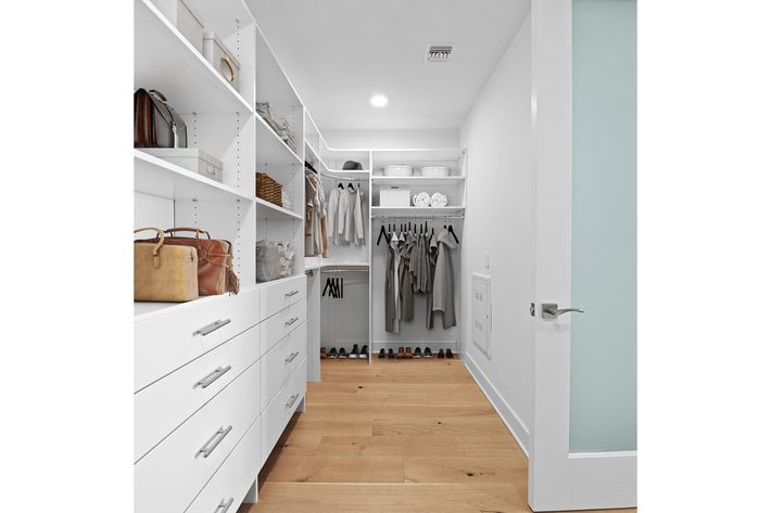 a kitchen with a sink and a refrigerator