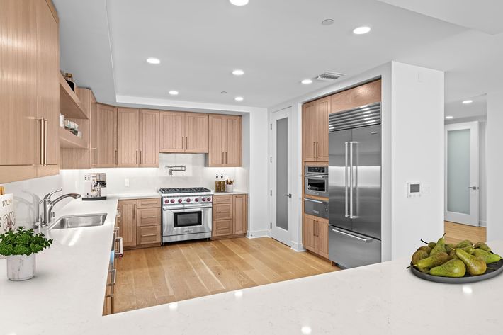 a modern kitchen with stainless steel appliances