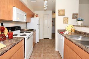 a kitchen with a stove and a sink