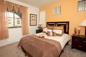 a bedroom with a large bed in a hotel room