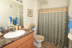 a shower curtain next to a sink