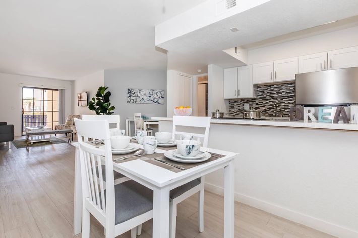 a kitchen with a dining room table