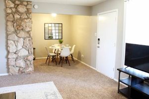 a living room filled with furniture and a fireplace