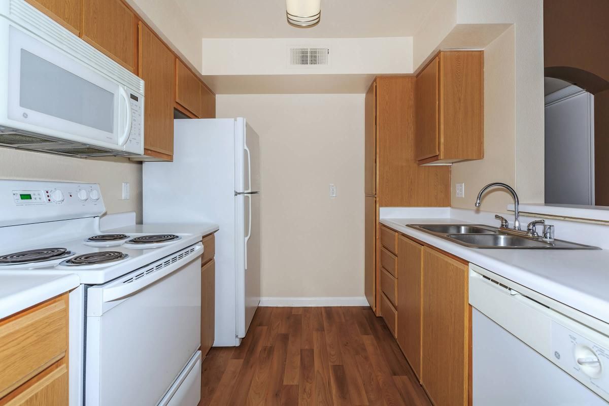 A COMPLETE KITCHEN WITH MICROWAVE, DISHWASHER, AND PANTRY