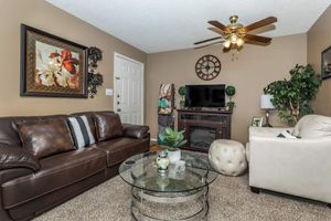 a brown leather couch in a living room