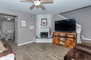 a living room filled with furniture and a fireplace