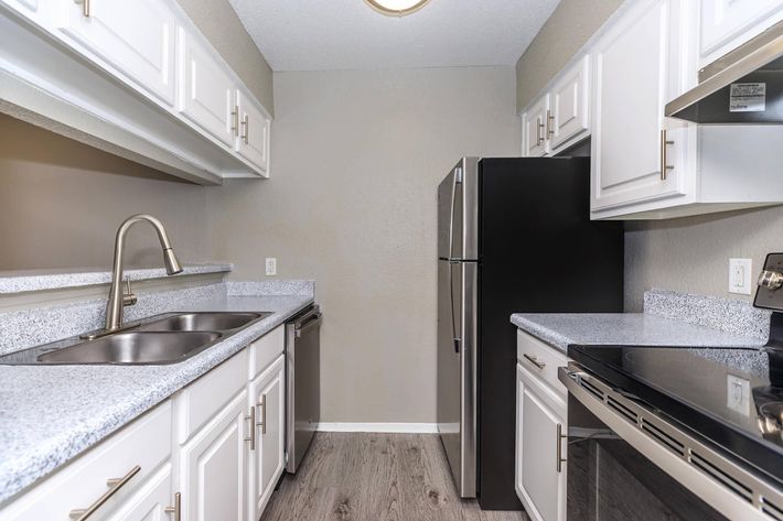 a large kitchen with stainless steel appliances