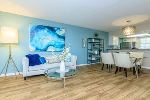 a living room filled with furniture and a table