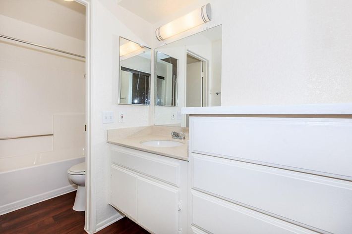 Bathroom with white cabinets