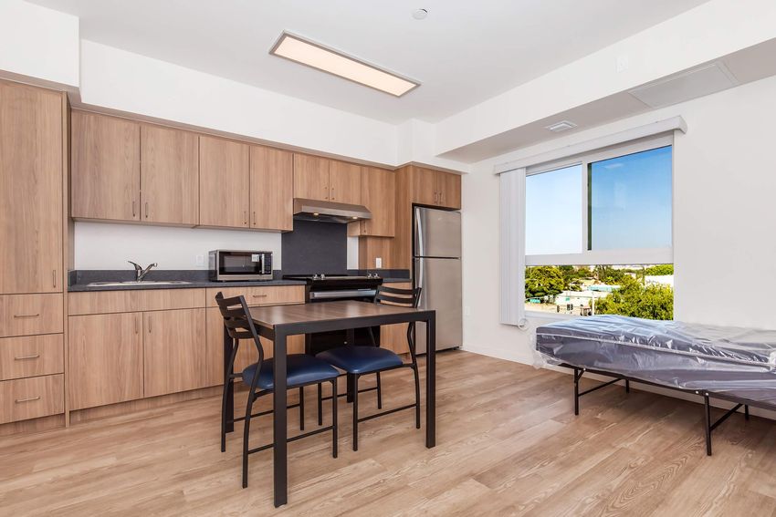 Furnished studio example and kitchenette.