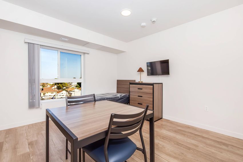 Furnished studio example with dining area.
