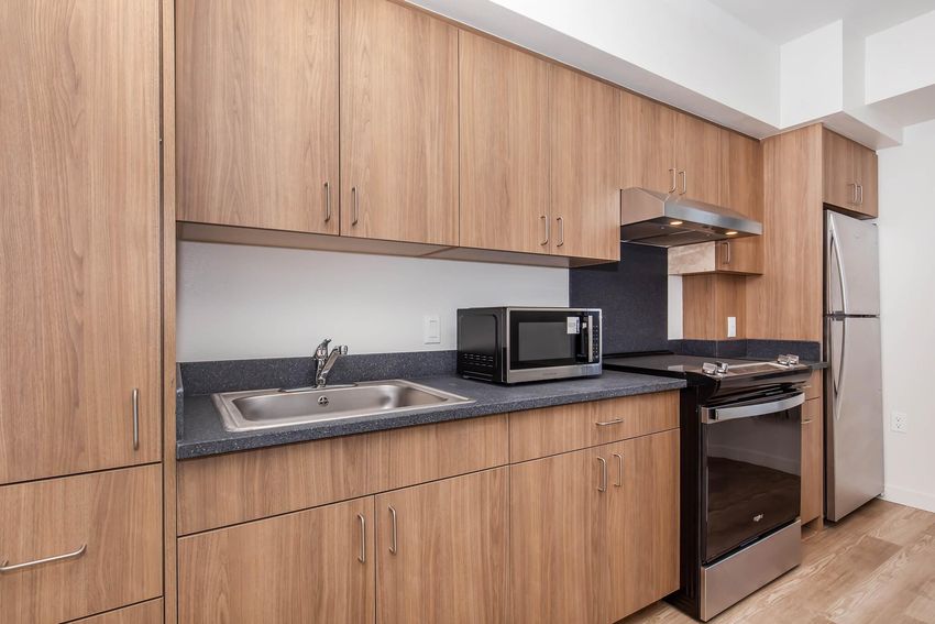 Kitchen in a furnished studio example.