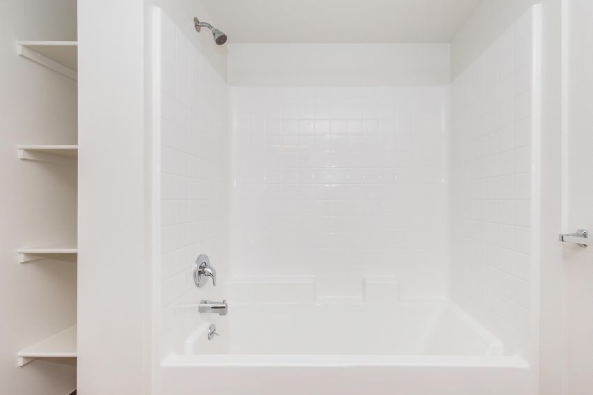 Bathtub and shower in a studio example.