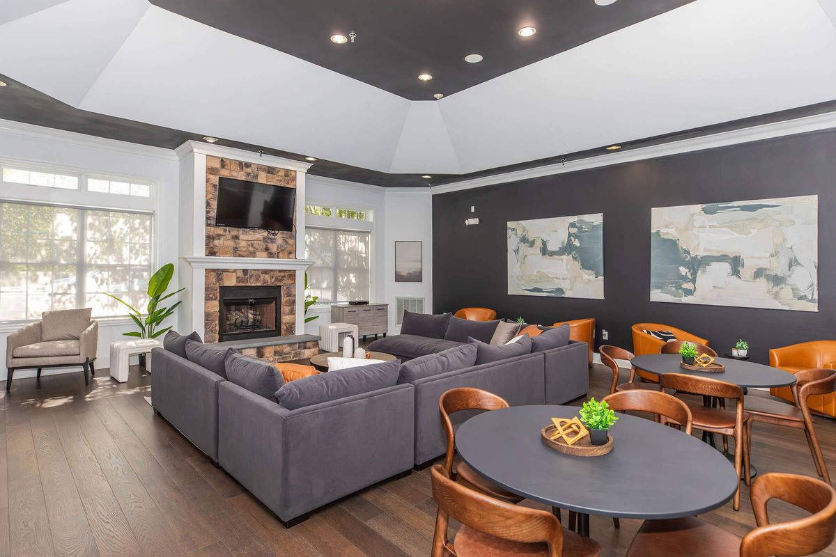 a living room filled with furniture and a large window