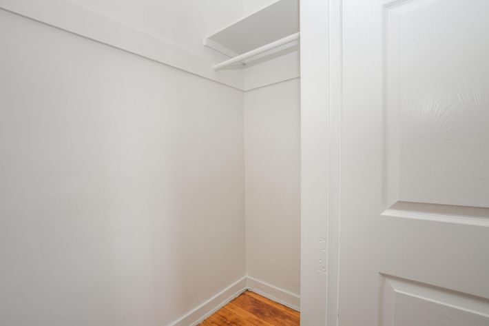 a white sink sitting next to a door