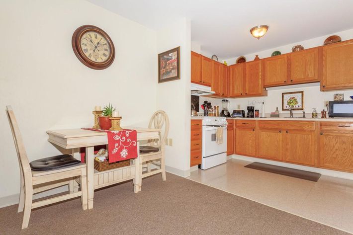 a kitchen with a table in a room