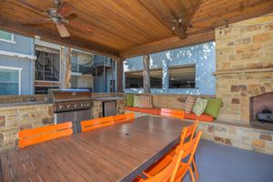 a kitchen with a table in front of a building