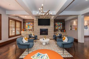 a living room filled with furniture and a fire place