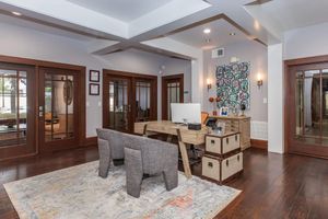 a living room filled with furniture and a large window