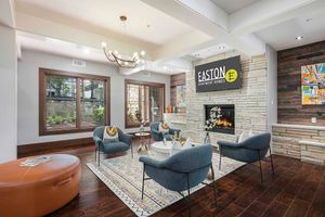 a living room filled with furniture and a fireplace