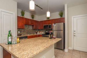 a kitchen with a sink and a mirror