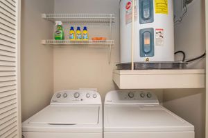 a refrigerator freezer sitting next to a sink