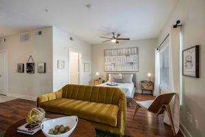 a living room filled with furniture and a table