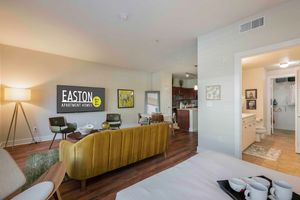 a living room filled with furniture and a flat screen tv