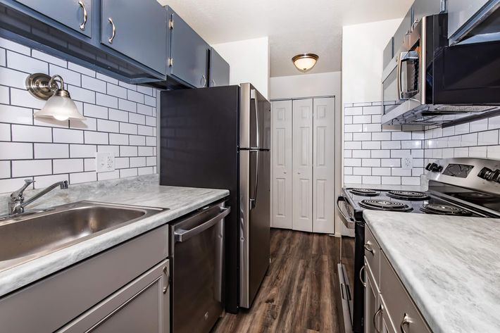 a large kitchen with stainless steel appliances