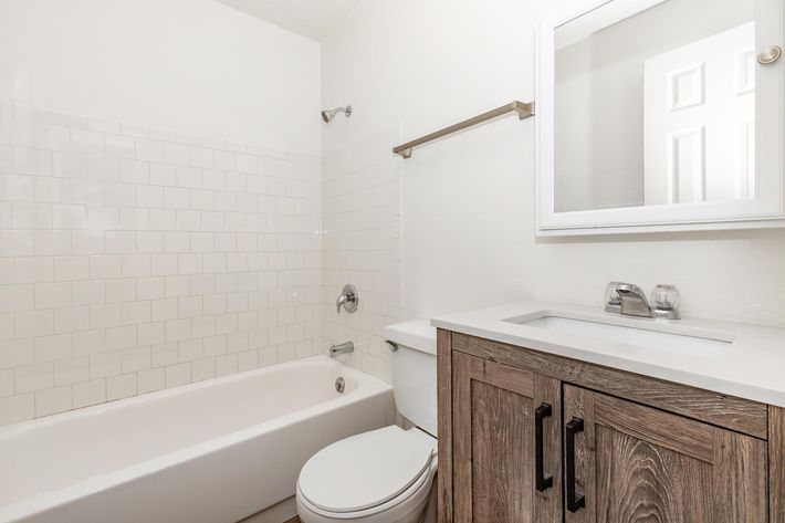 a sink sitting under a window