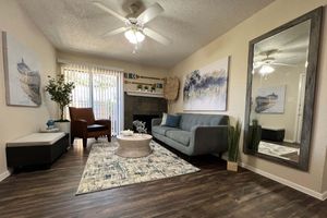 a living room filled with furniture and a fireplace