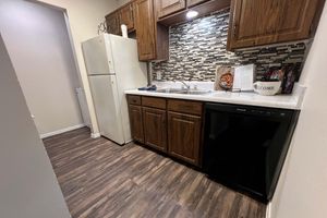 a kitchen with a wooden floor