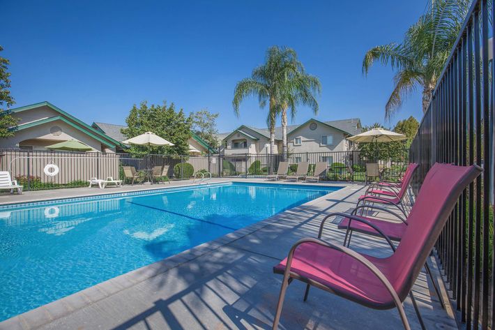 a large red chair in a pool