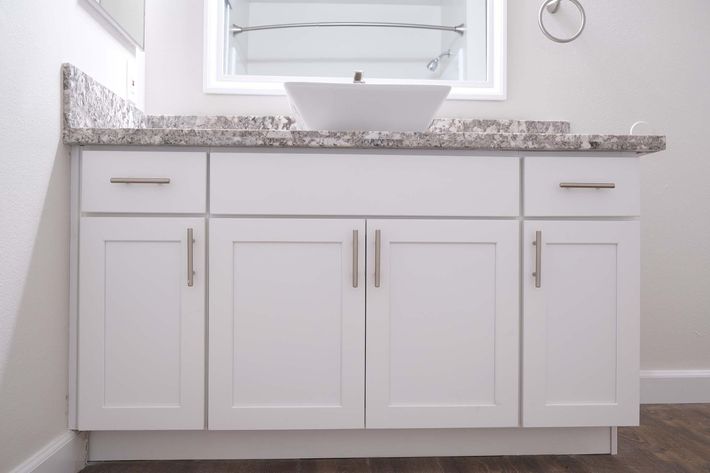 a kitchen with a sink and a refrigerator