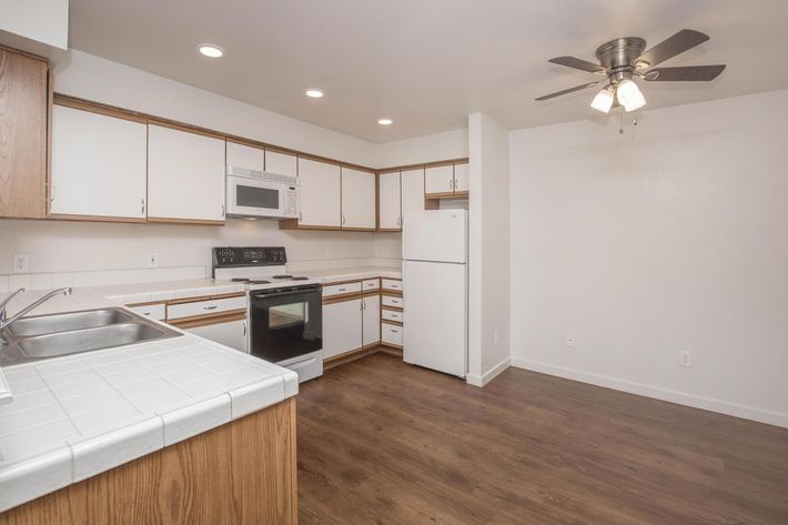 a kitchen with a stove and a sink