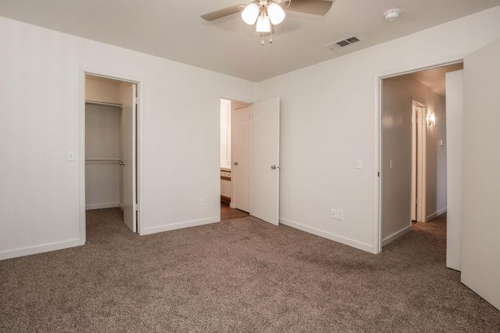 a large white refrigerator in a small room