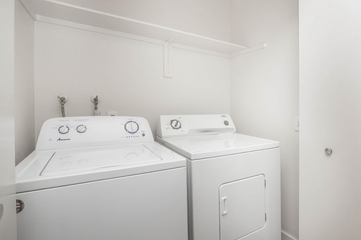 a white refrigerator freezer sitting in a room