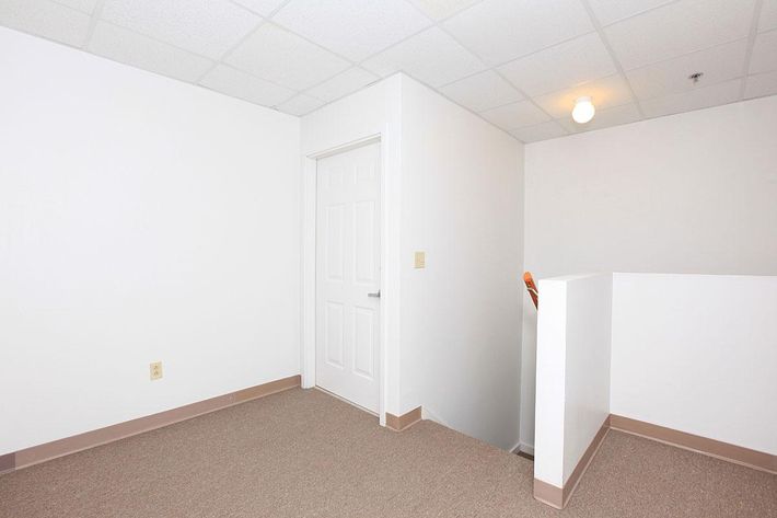 a white refrigerator freezer sitting in a room