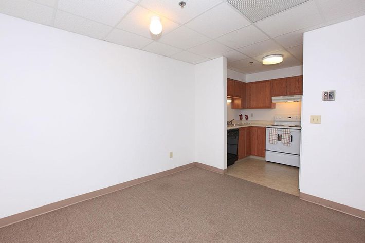 a white refrigerator freezer sitting inside of a kitchen