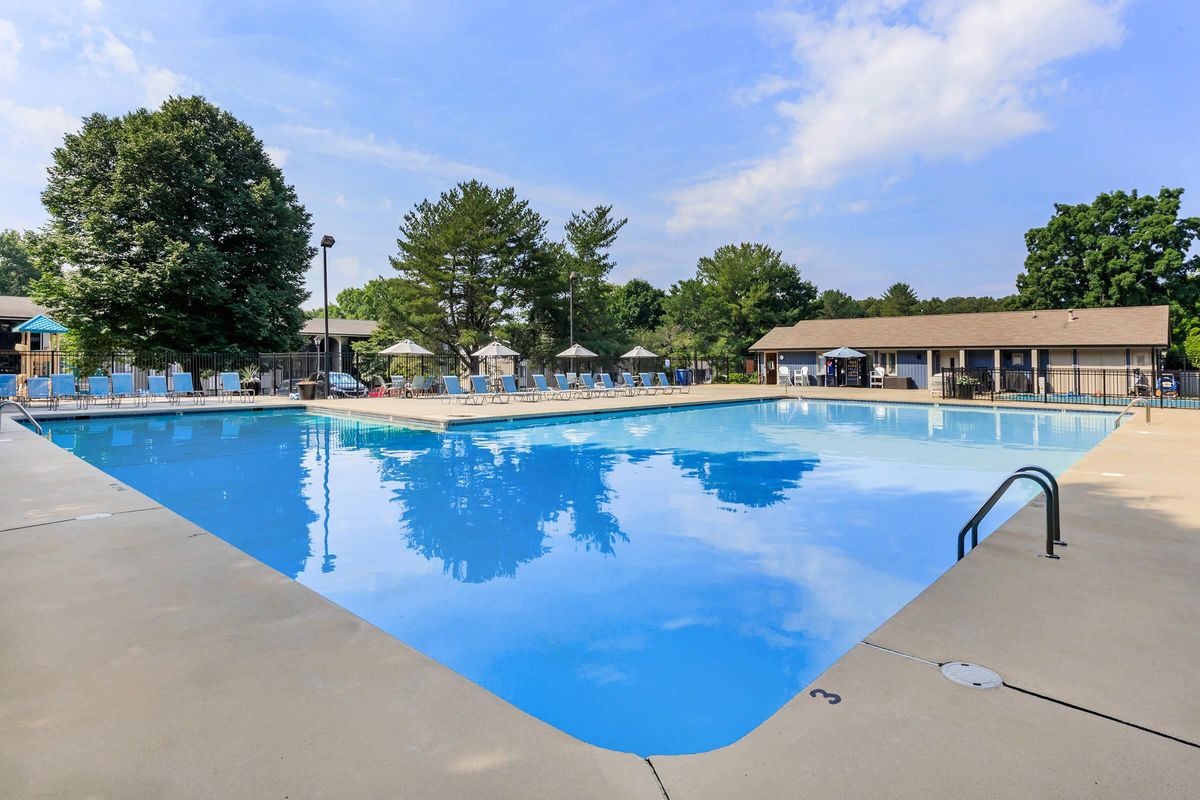 a pool next to a body of water