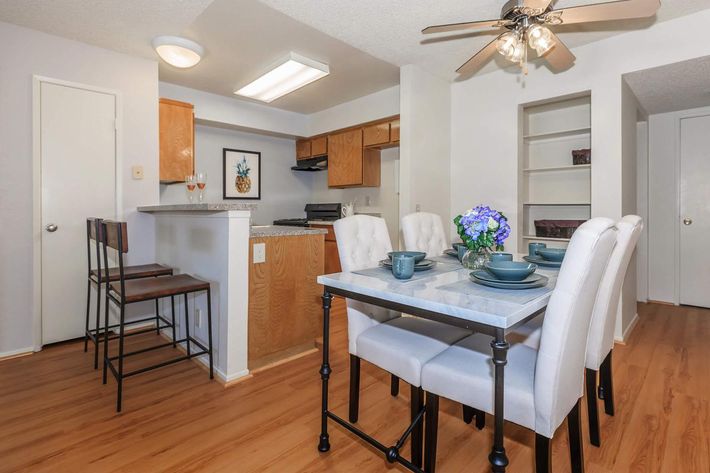 a kitchen with a table in a room