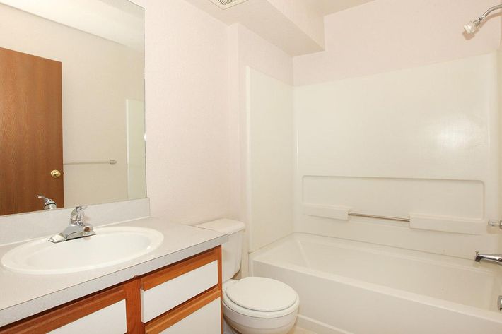 a room with a sink and a mirror