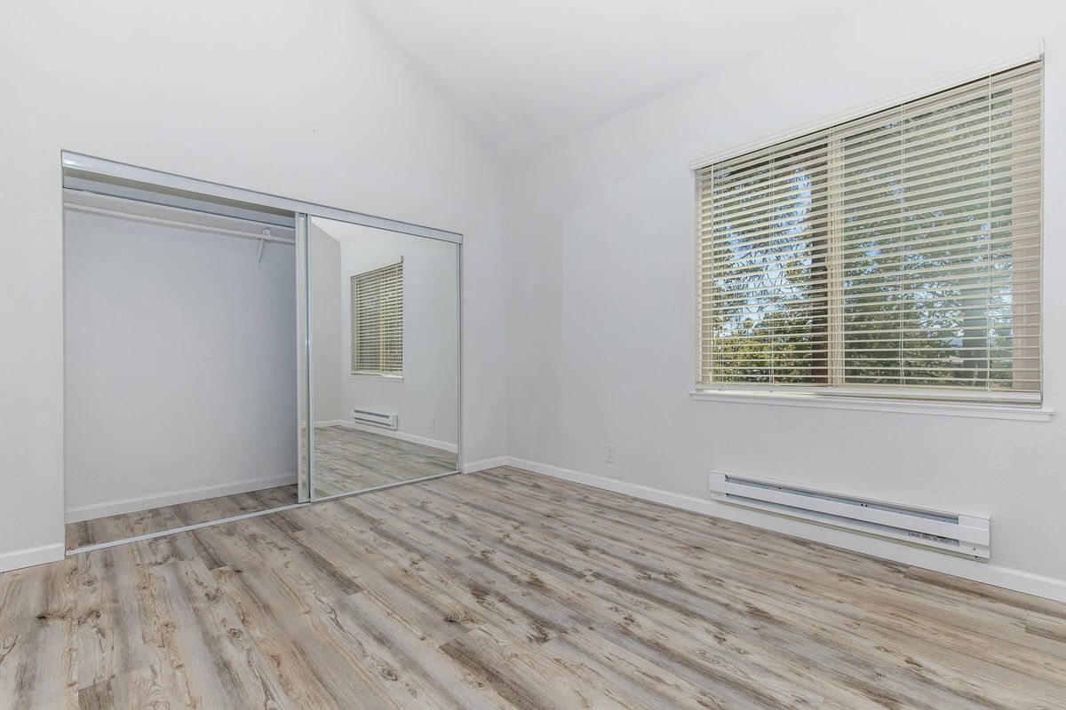 a bedroom with a large window