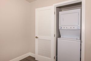 a white refrigerator freezer sitting next to a door