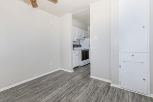 a kitchen with a wooden floor