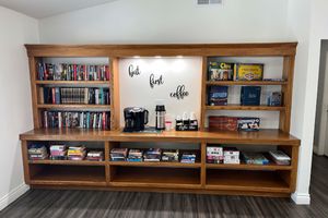 a living room with a book shelf